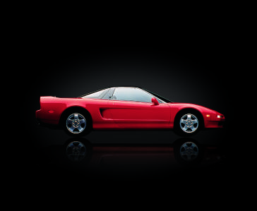 The groundbreaking first-generation Acura NSX featured the first mass-produced aluminum monocoque body for a production vehicle, titanium connecting rods and the first application of variable valve timing and lift with its innovative new VTEC® valvetrain system.